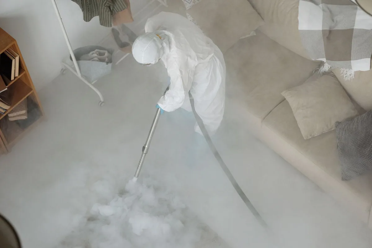 Biohazard cleanup technician in protective equipment, Bodega Bay, CA